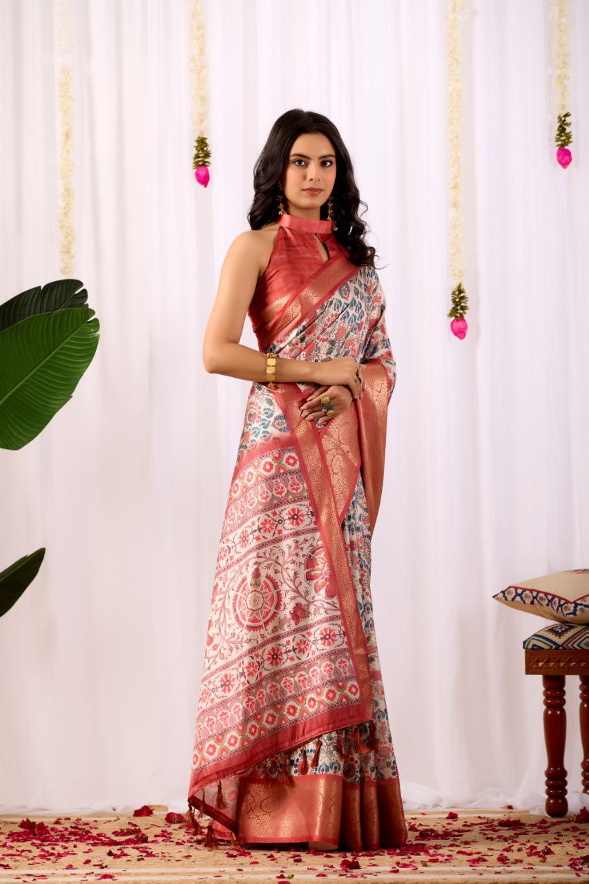 Premium Soft Lichi Silk Saree with elegant Patola-inspired geometric prints beautifully crafted with a luxurious zari woven border.