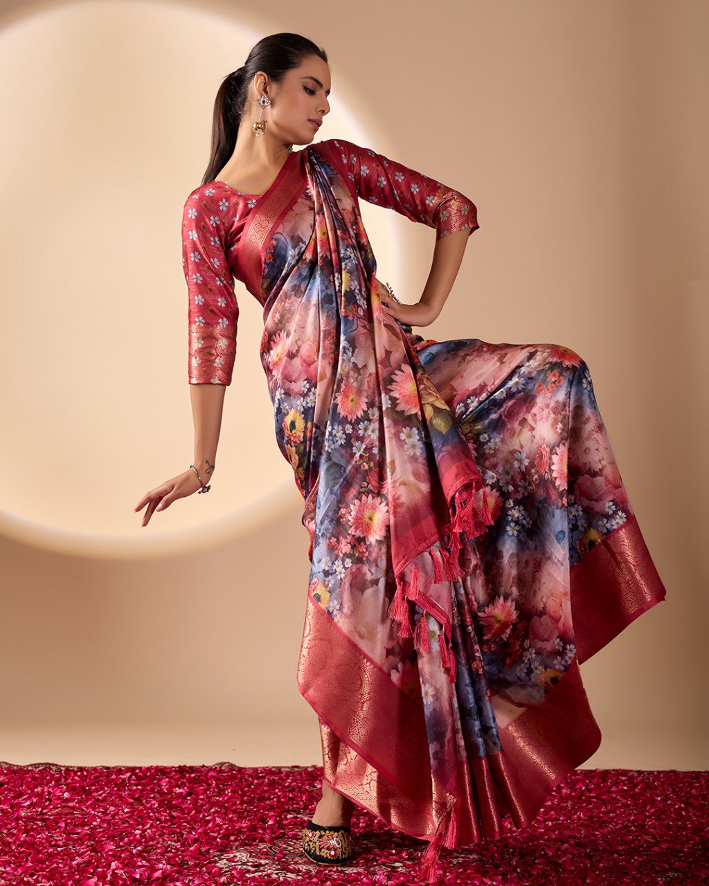 Luxurious Soft Lichi Silk Saree in Deep Wine Rose Shade featuring enchanting floral digital prints and complemented by a rich woven zari border & pallu — an epitome of elegance, beauty, and sophistication.