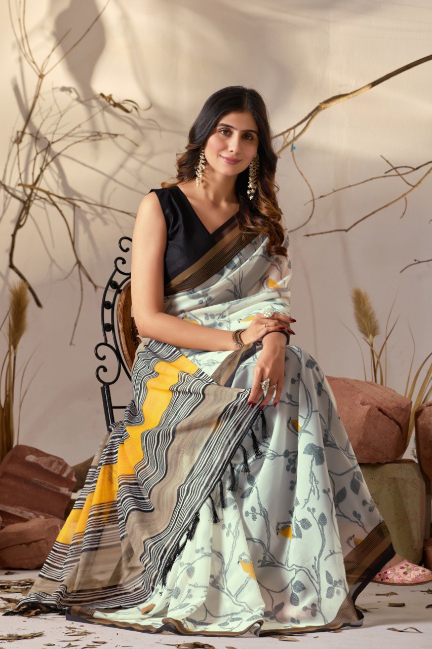 Soft Georgette Lightweight Saree with Delicate Cream Base, Adorned with Subtle Bird & Branch Motifs and Finished with Bold Mustard-Yellow & Black Striped Digital Print Border and Pallu with Elegant Tassel Detailing