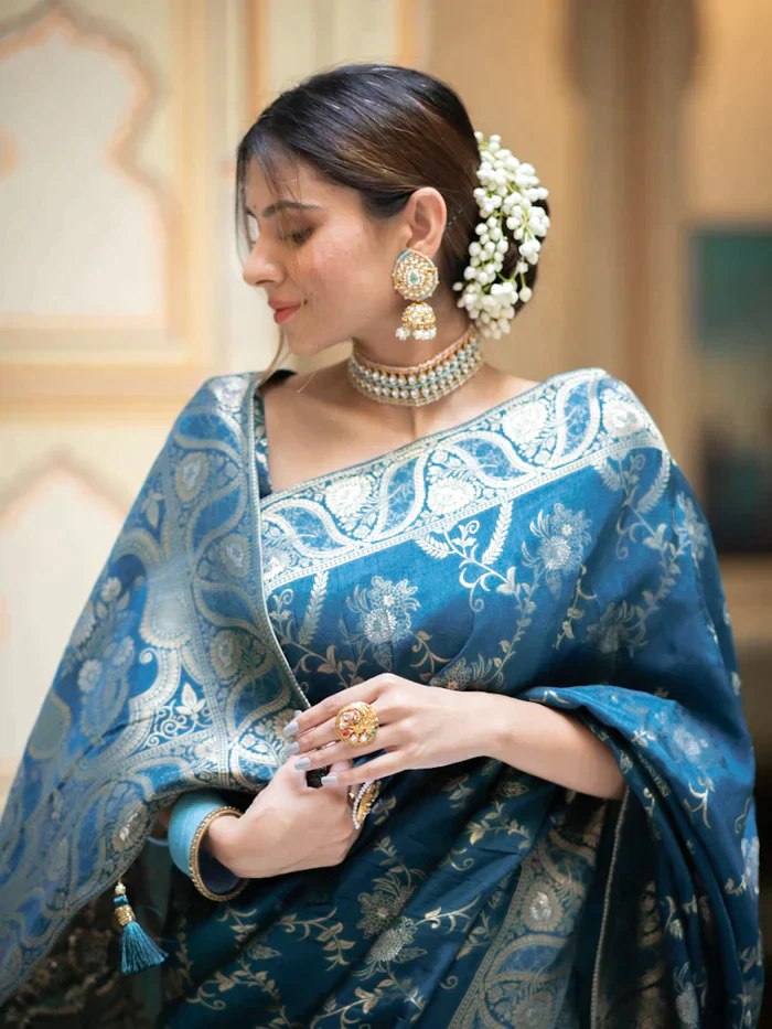 The richly crafted border and opulent pallu showcase traditional Banarasi Silk sarees
