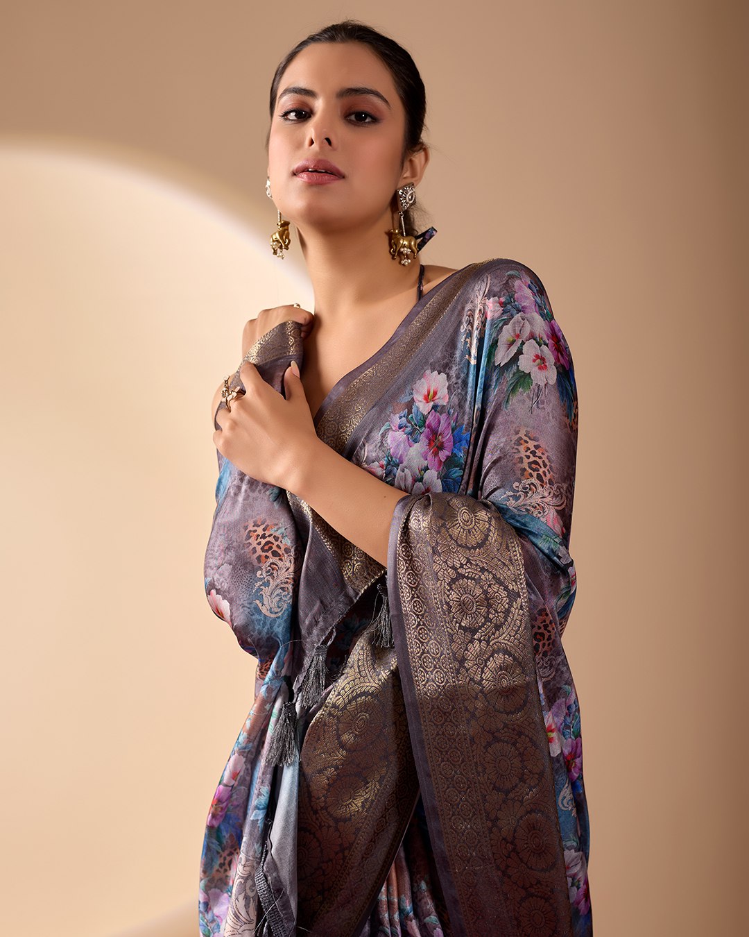 Gorgeous Soft Lichi Silk Saree featuring enchanting digital floral prints on a rich smoky grey base with an intricate golden zari border.