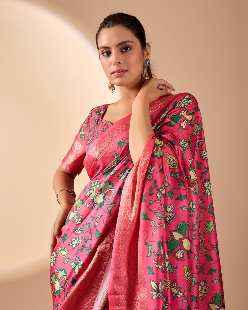 oft Lichi Silk Saree enriched with vibrant floral digital prints and a beautifully woven zari border.