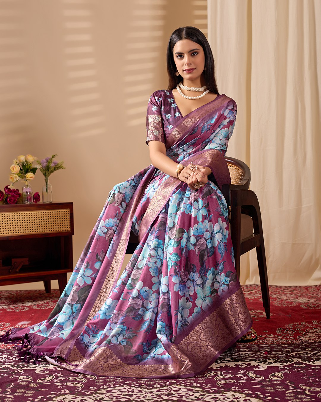 oft Lichi Silk Saree beautifully enhanced with large blooming floral prints and a rich zari woven border.