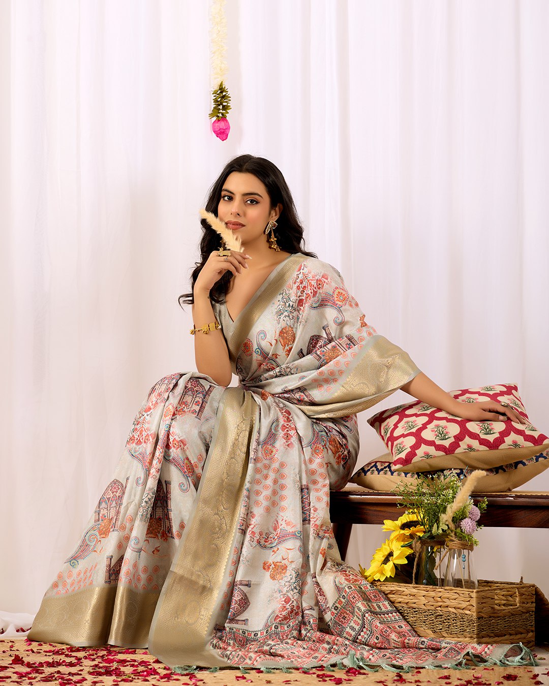 Elegant Soft Lichi Silk Saree featuring royal ethnic motifs with a lavish golden zari woven border, bringing together rich heritage and modern sophistication.