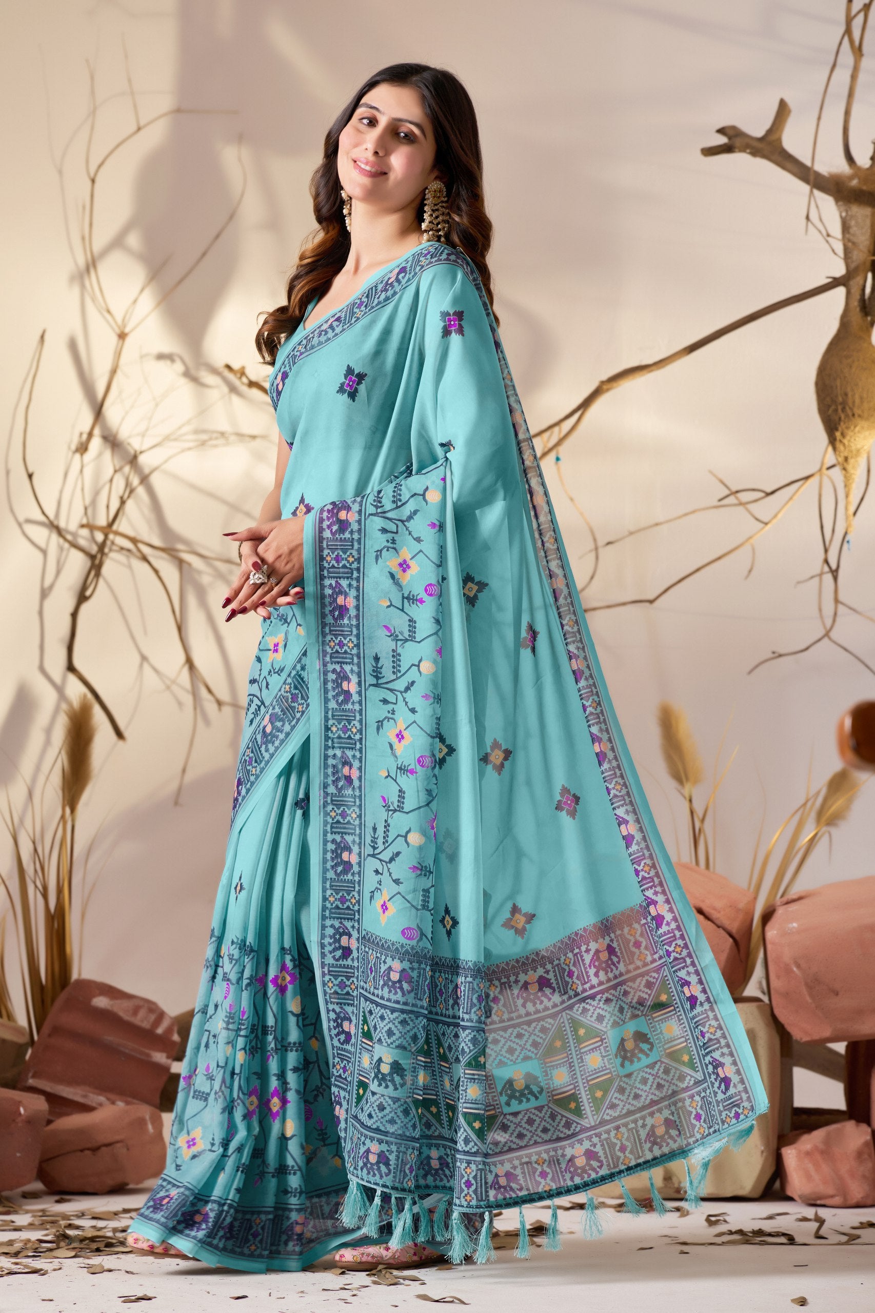 Soft Georgette Saree in Refreshing Sea Green Tone Highlighted with Intricate Digital Tribal & Floral Print, Featuring Artistic Elephant & Geometric Motifs with Elegant Tassel Detailing on Pallu