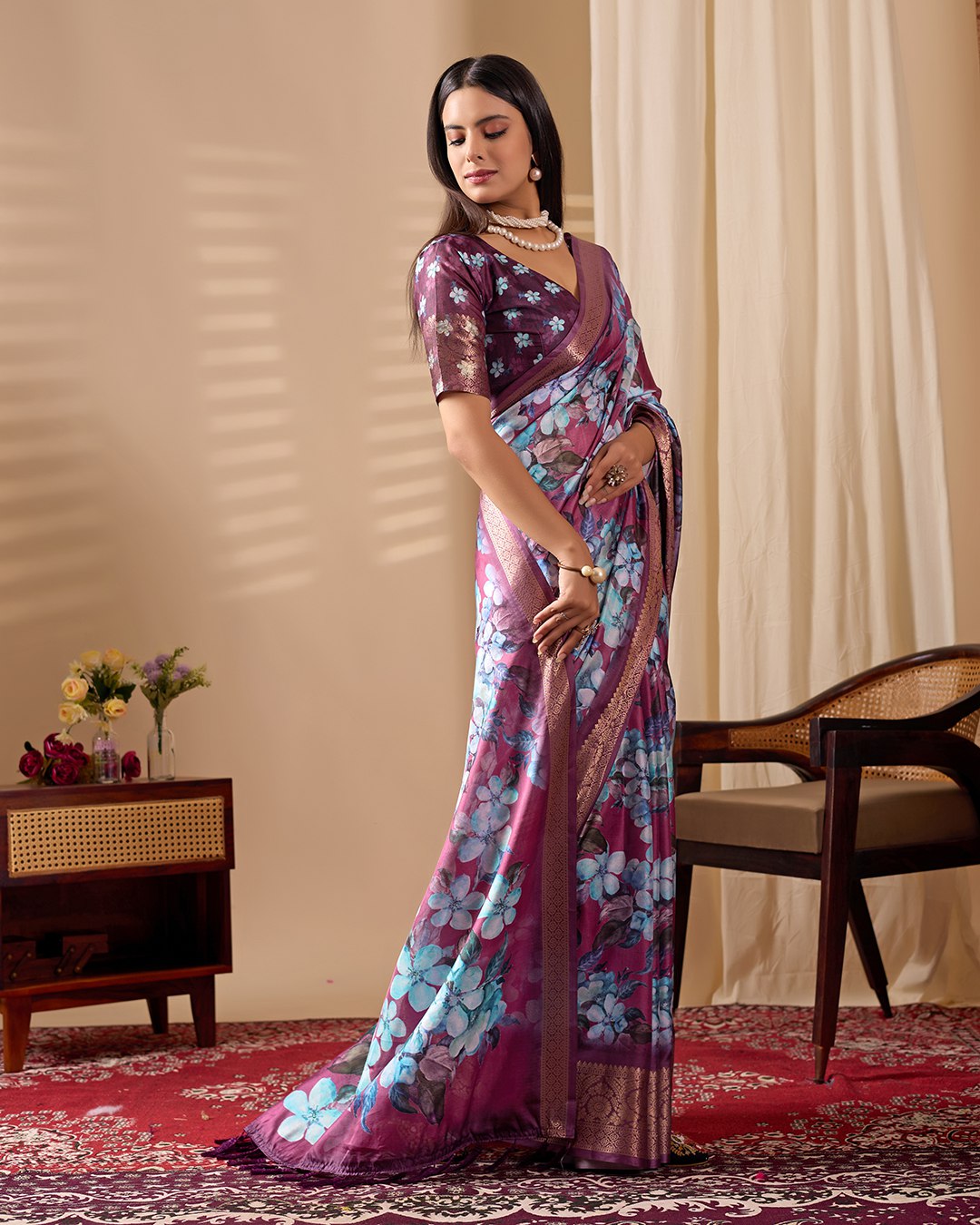 oft Lichi Silk Saree beautifully enhanced with large blooming floral prints and a rich zari woven border.