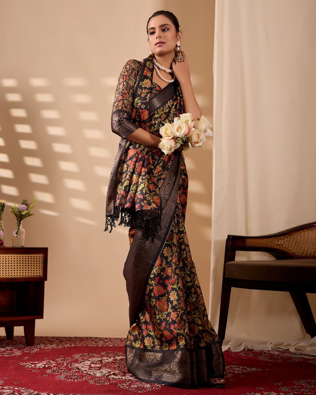 Exquisite Soft Lichi Silk Saree featuring stunning digital floral motifs on a rich black base, beautifully complemented by a luxurious golden zari border.