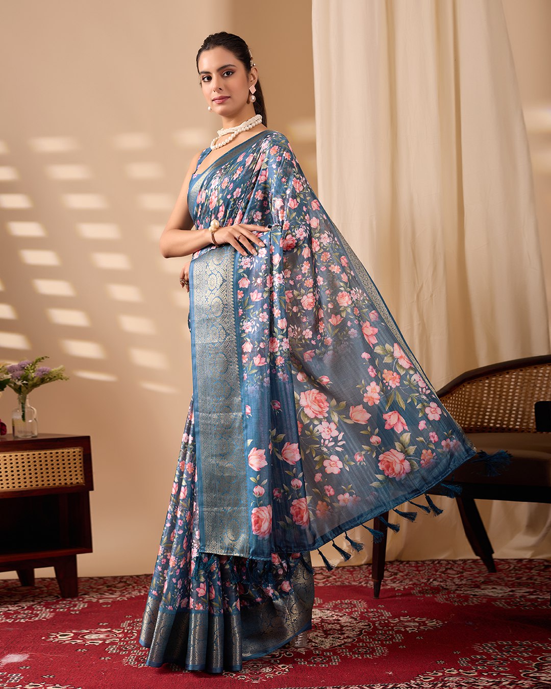 Gorgeous Soft Lichi Silk Saree in Deep Teal Blue, adorned with Romantic Rose Floral Digital Prints and finished with an Intricately Woven Golden Zari Border — perfect for festive gatherings, elegant evenings, or special celebrations.