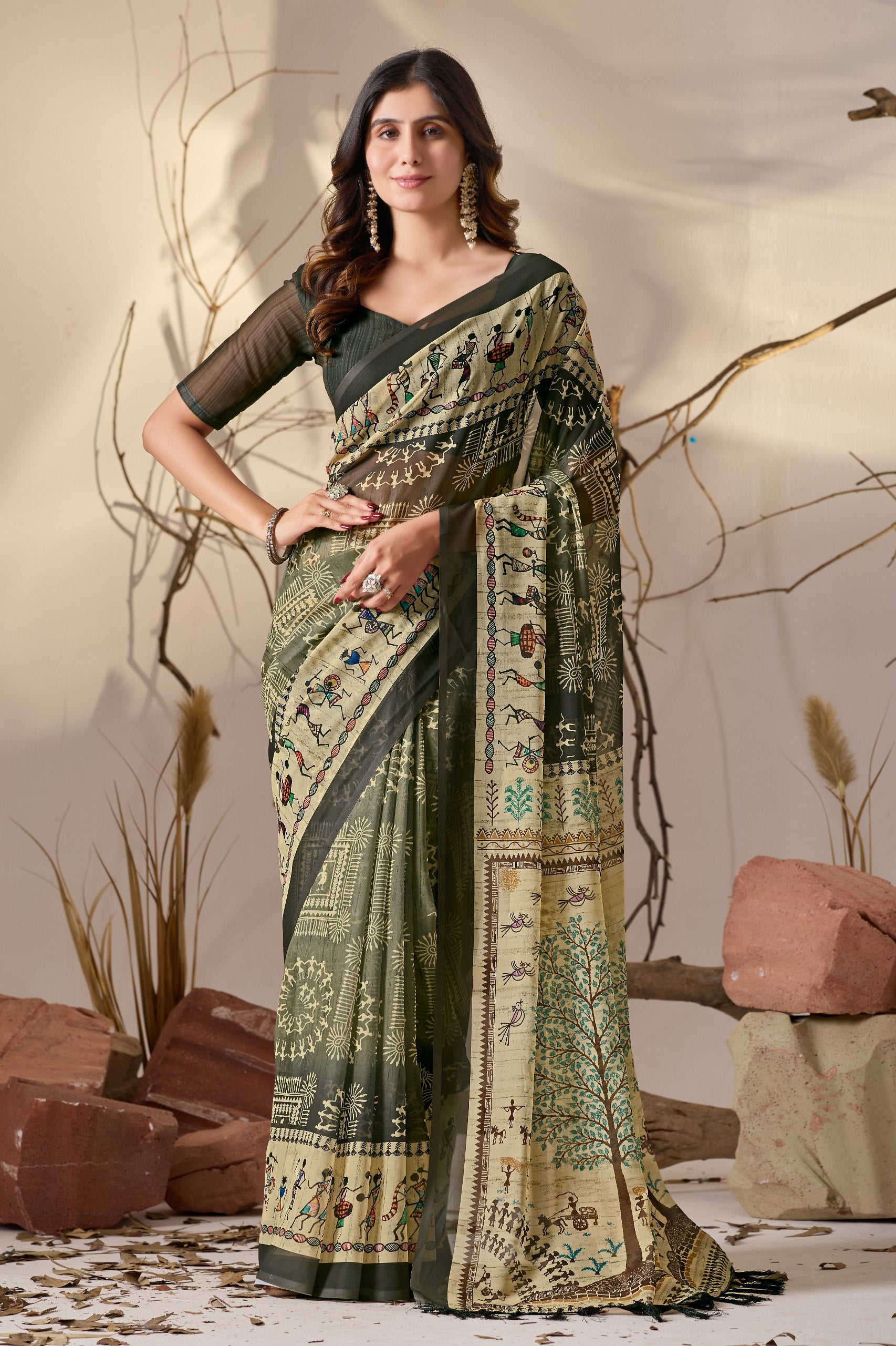 Soft Georgette Saree in Olive Green with Traditional Tribal Warli-Inspired Digital Prints and Rich Beige Panels Highlighted with Nature, Dance & Village Motifs + Intricate Tassel Detailing on the Pallu