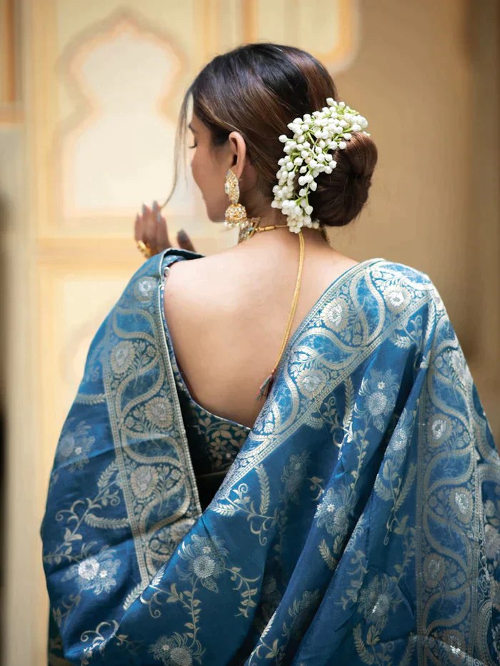 The richly crafted border and opulent pallu showcase traditional Banarasi Silk sarees