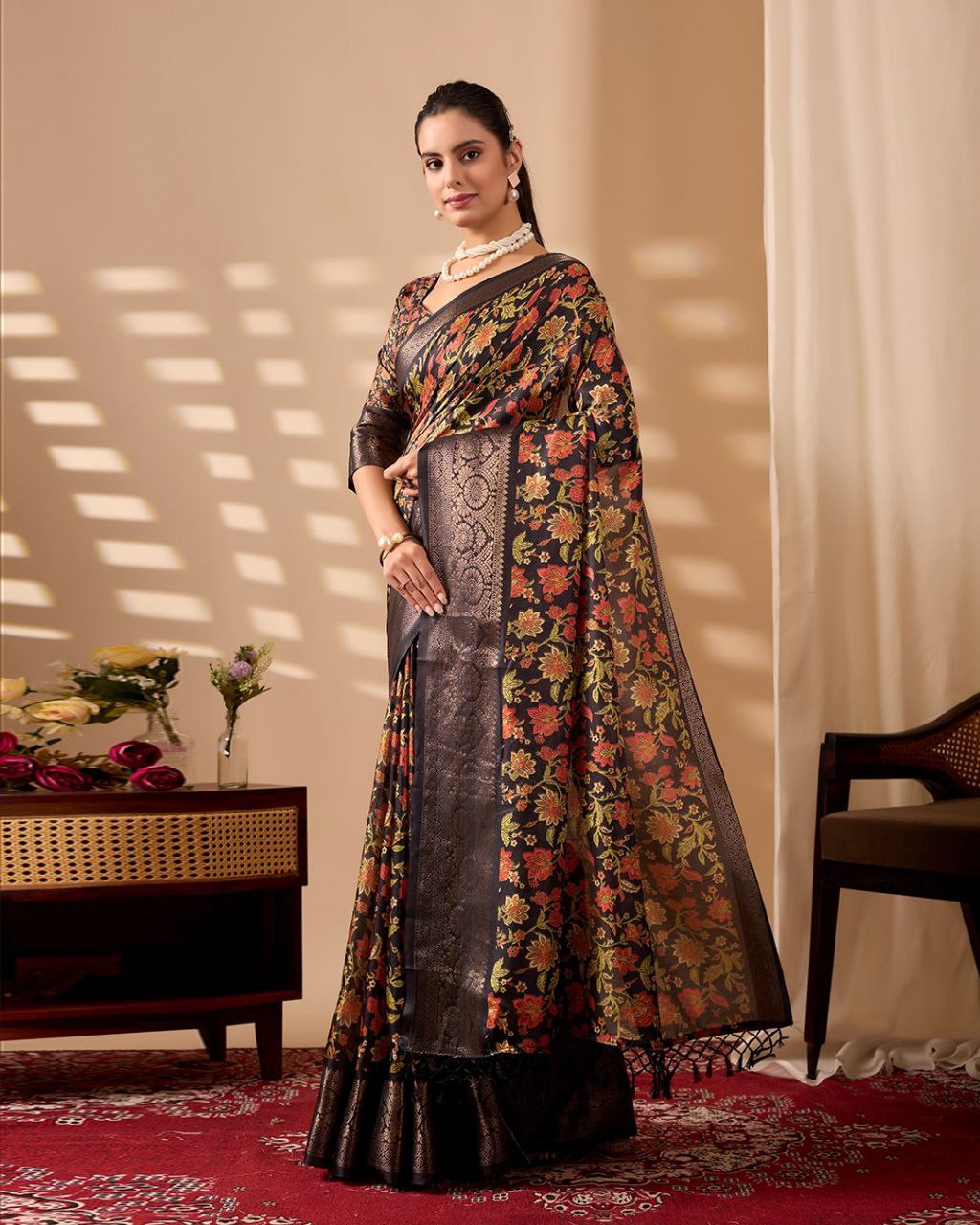 Exquisite Soft Lichi Silk Saree featuring stunning digital floral motifs on a rich black base, beautifully complemented by a luxurious golden zari border.