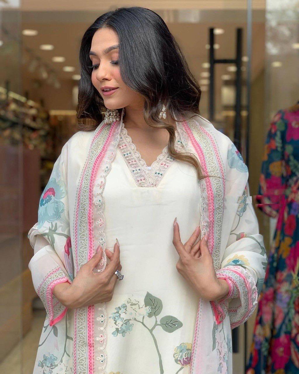 Off White  Color Suit Set  seems to be a party wear outfit made from TB Silk fabric with digital Prints TB Silk Duptta wih Embroidery sequence Lace.(3-Pair)