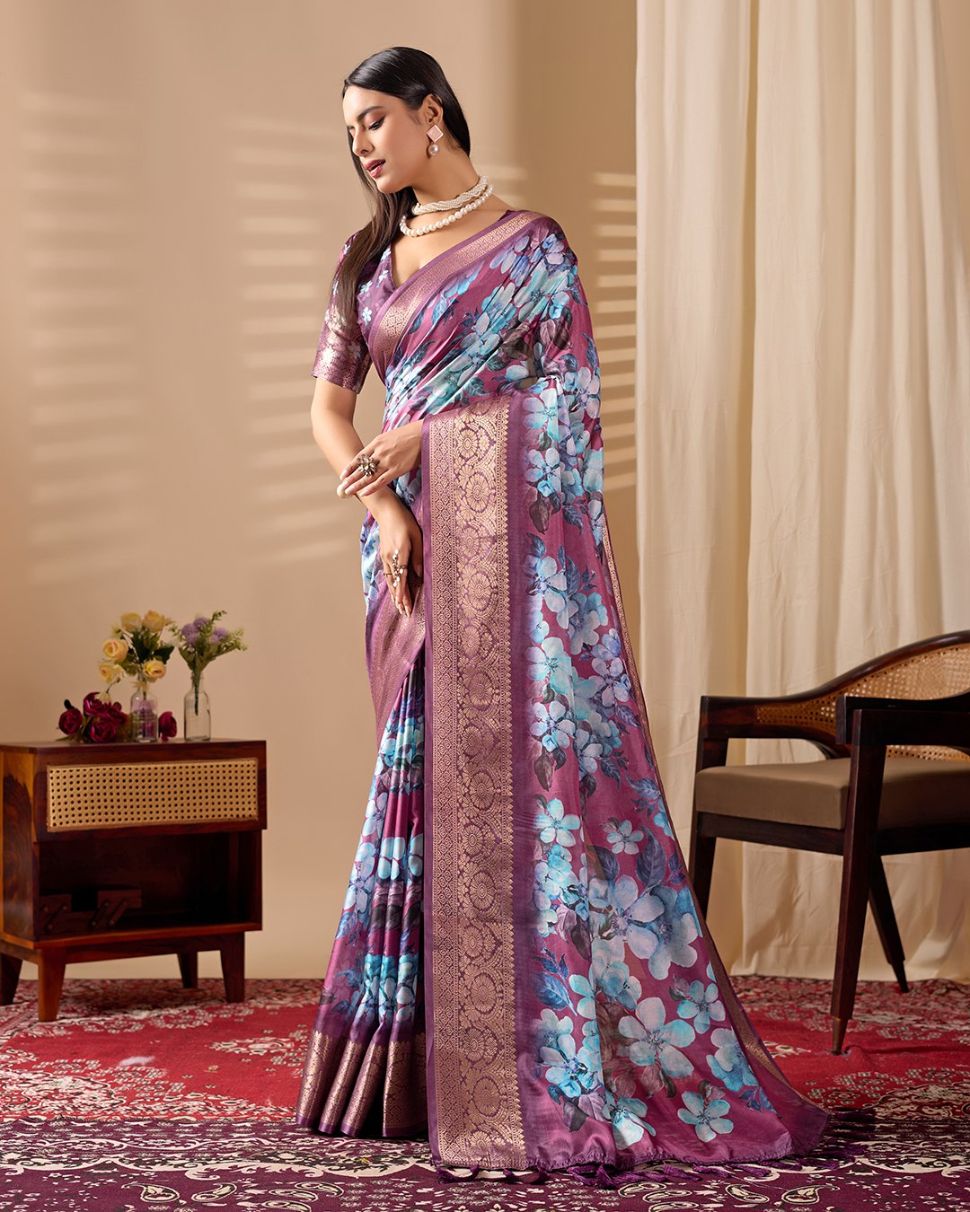 oft Lichi Silk Saree beautifully enhanced with large blooming floral prints and a rich zari woven border.