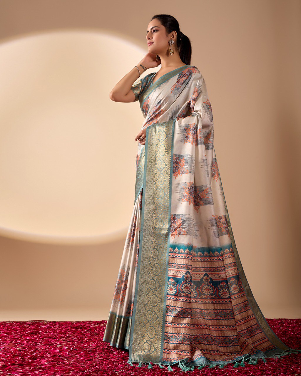 Elegant Soft Lichi Silk Saree in a refined ivory and teal tone, featuring traditional motifs and intricate digital prints enhanced with a golden zari border.