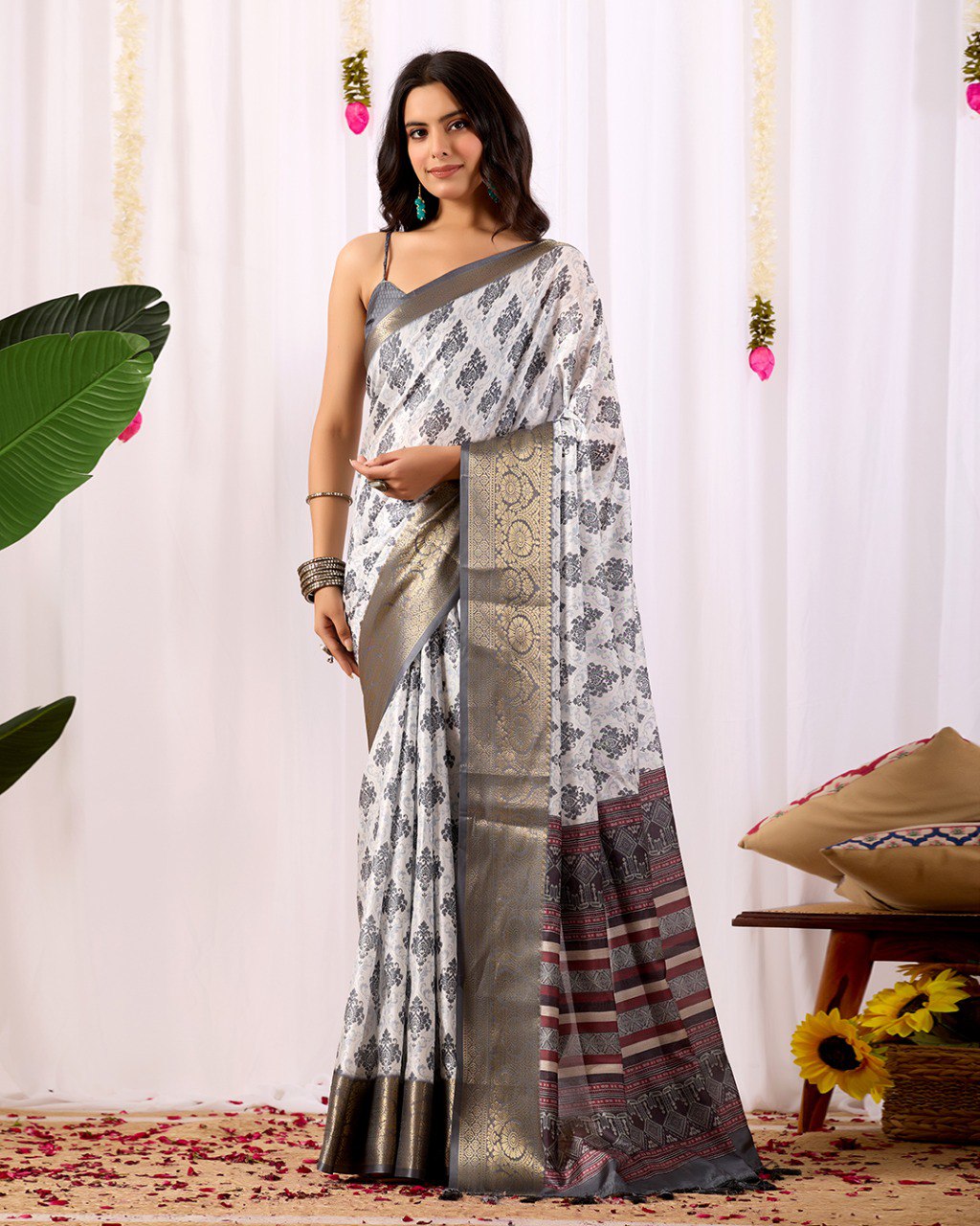 Premium Soft Lichi Silk Saree in Elegant White Base featuring intricate black ethnic motifs, beautifully complemented with a luxurious golden zari woven border and a rich maroon pallu