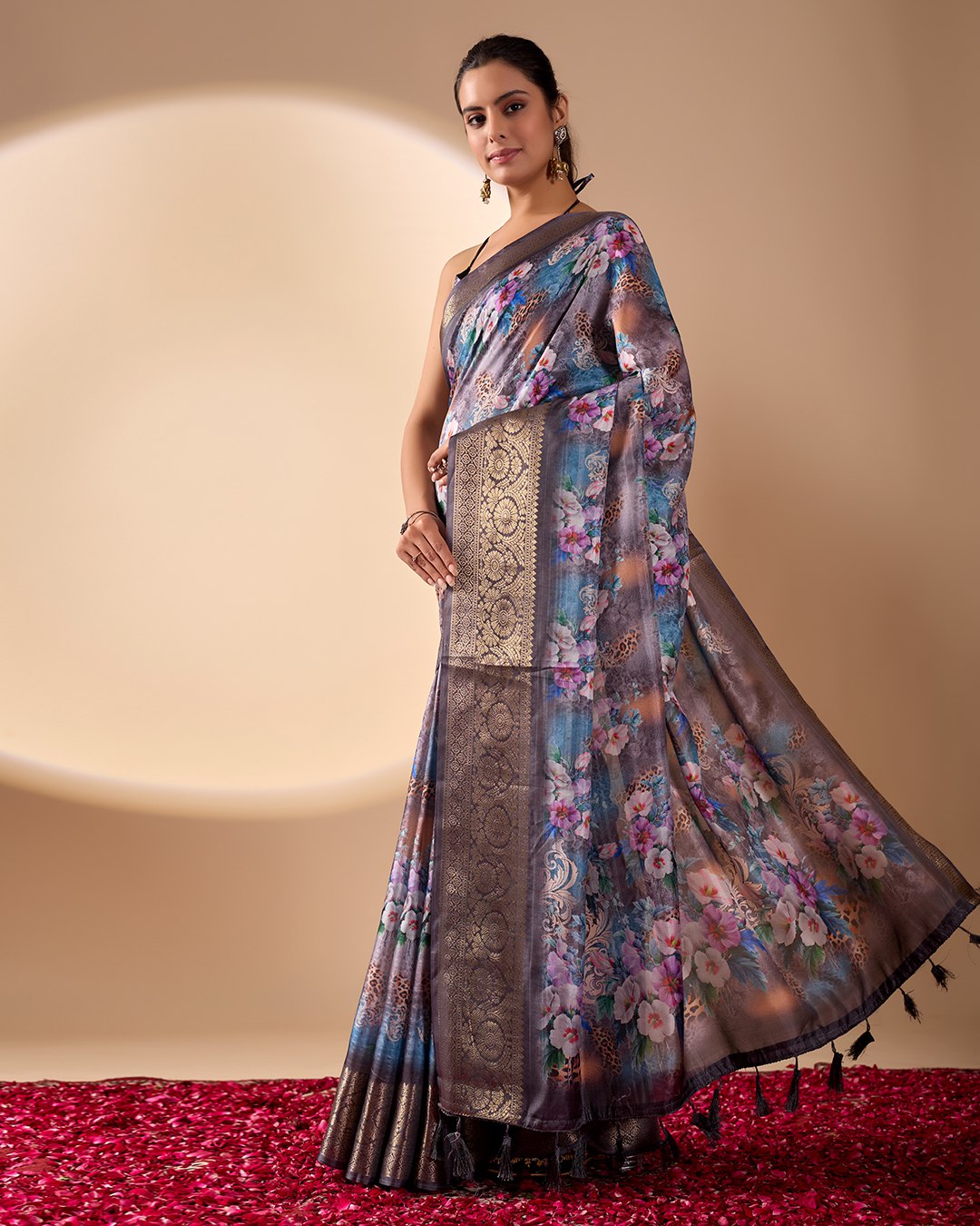 Gorgeous Soft Lichi Silk Saree featuring enchanting digital floral prints on a rich smoky grey base with an intricate golden zari border.