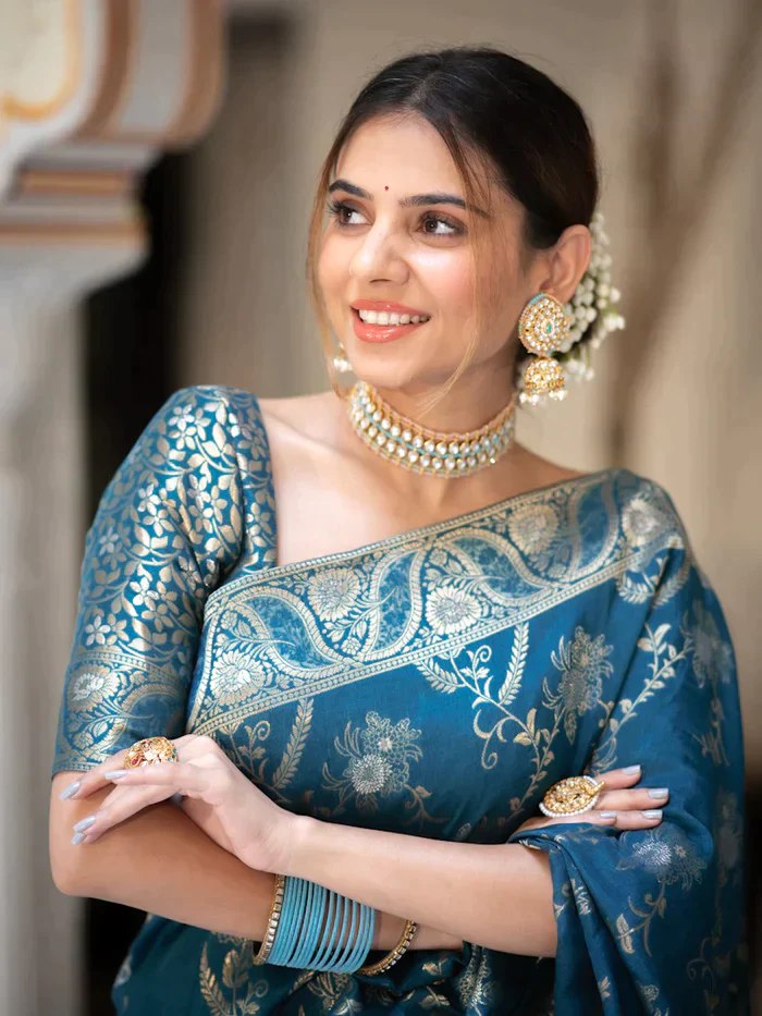The richly crafted border and opulent pallu showcase traditional Banarasi Silk sarees