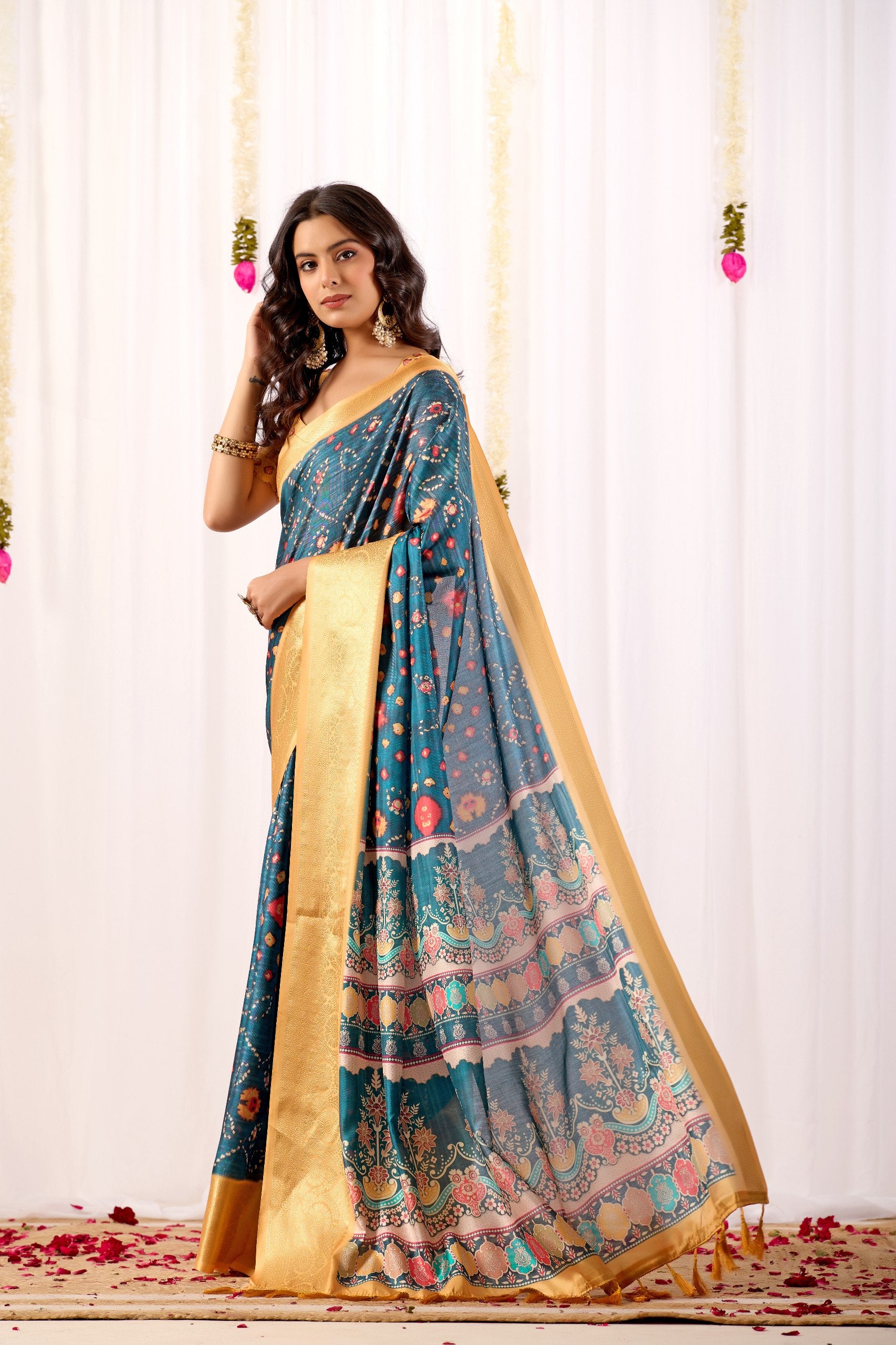 Soft Lichi Silk Saree featuring an Elegant Tribal Art Print complemented by a Luxurious Rich Zari Border. The blend of traditional artistry and silky sheen adds a royal touch to your festive look.