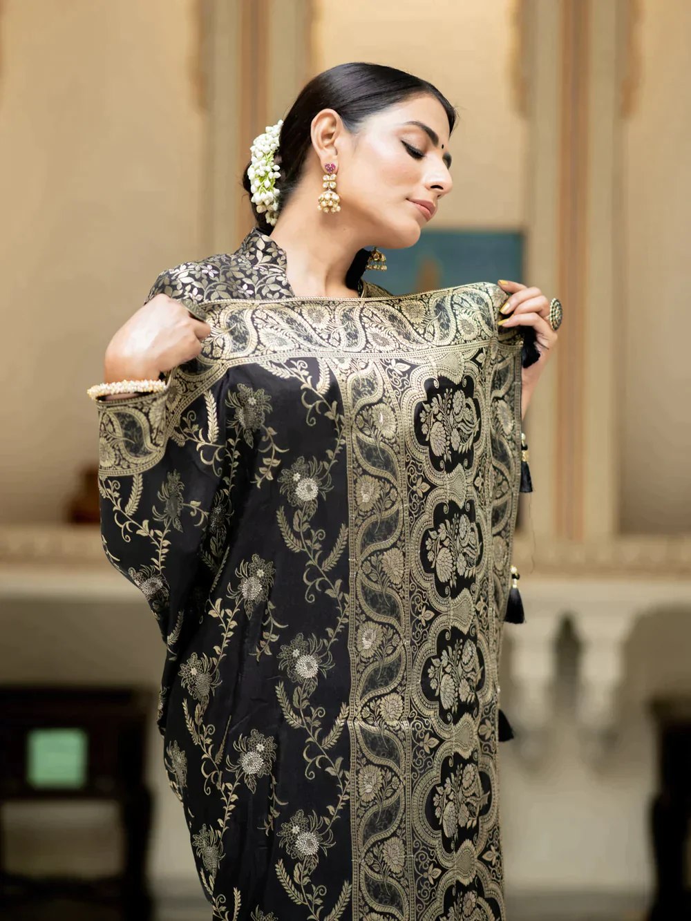 The richly crafted border and opulent pallu showcase traditional Banarasi Silk sarees
