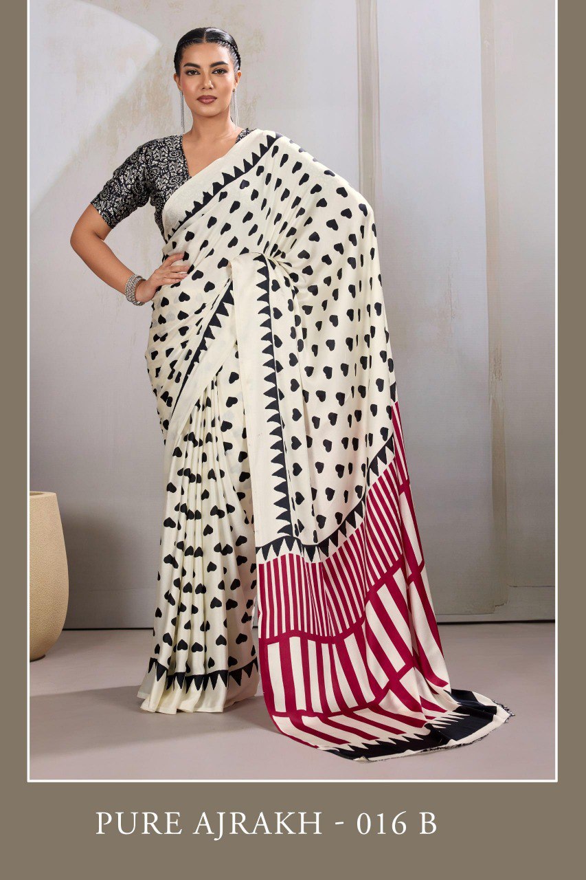Pure Ajrakh modal satin fabric featuring traditional printed motifs with rich, earthy tones and a soft, breathable feel, perfect for all-day elegance.