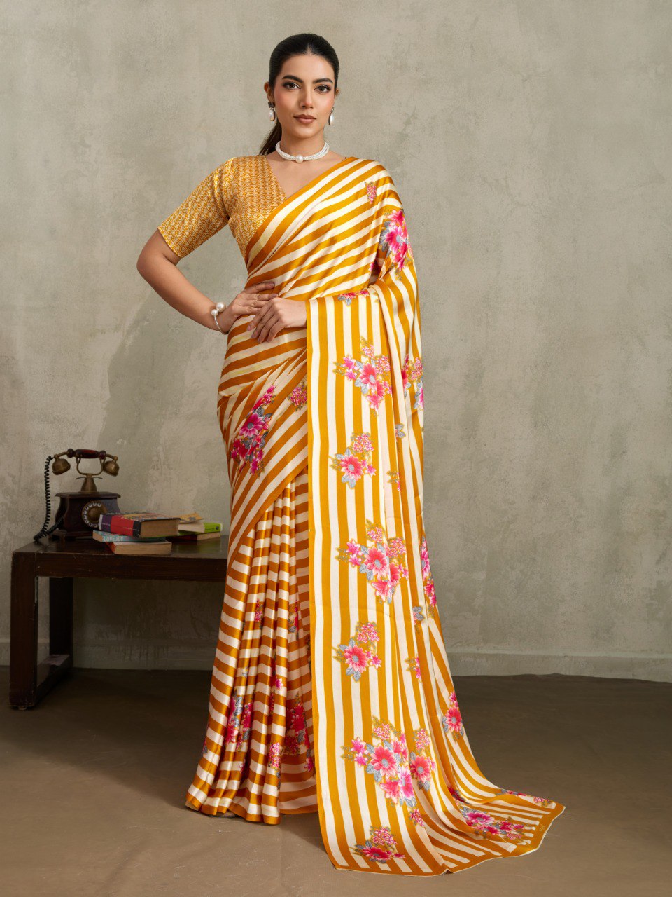 Pure Ajrakh modal satin fabric featuring traditional printed motifs with rich, earthy tones and a soft, breathable feel, perfect for all-day elegance.