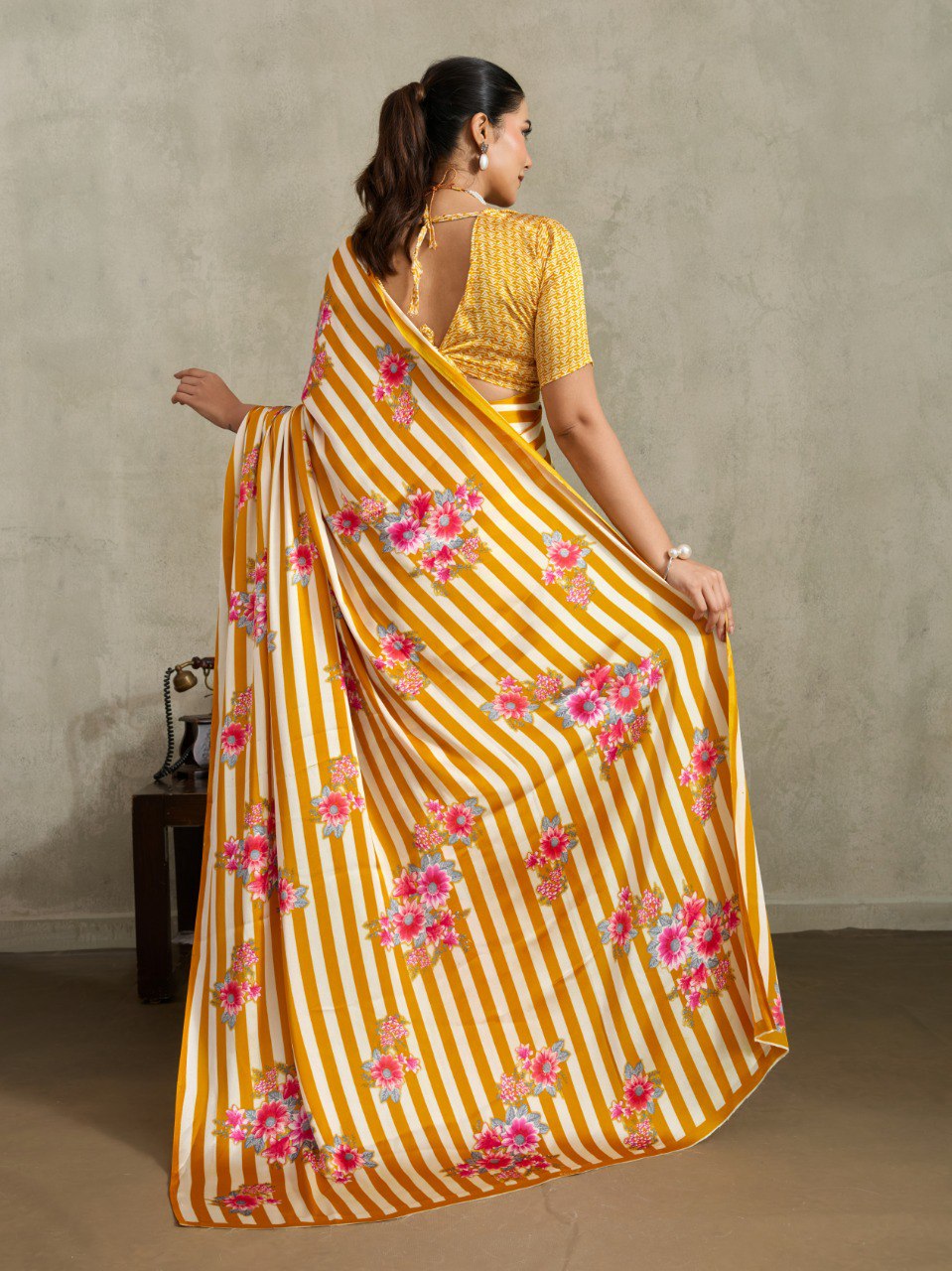 Pure Ajrakh modal satin fabric featuring traditional printed motifs with rich, earthy tones and a soft, breathable feel, perfect for all-day elegance.