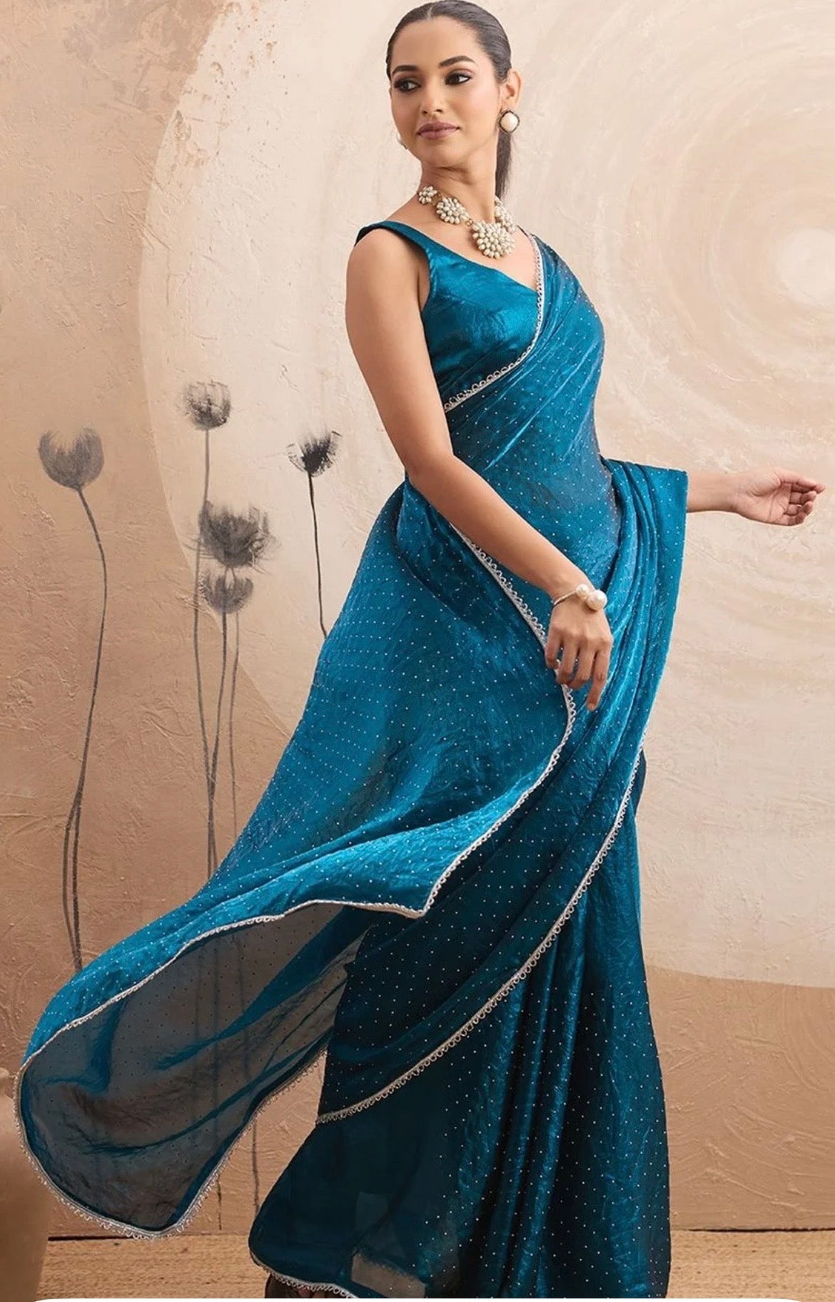 This beautiful saree is elegantly decorated with gorgeous Solid Lace Border that gives a perfect look to the outfit.