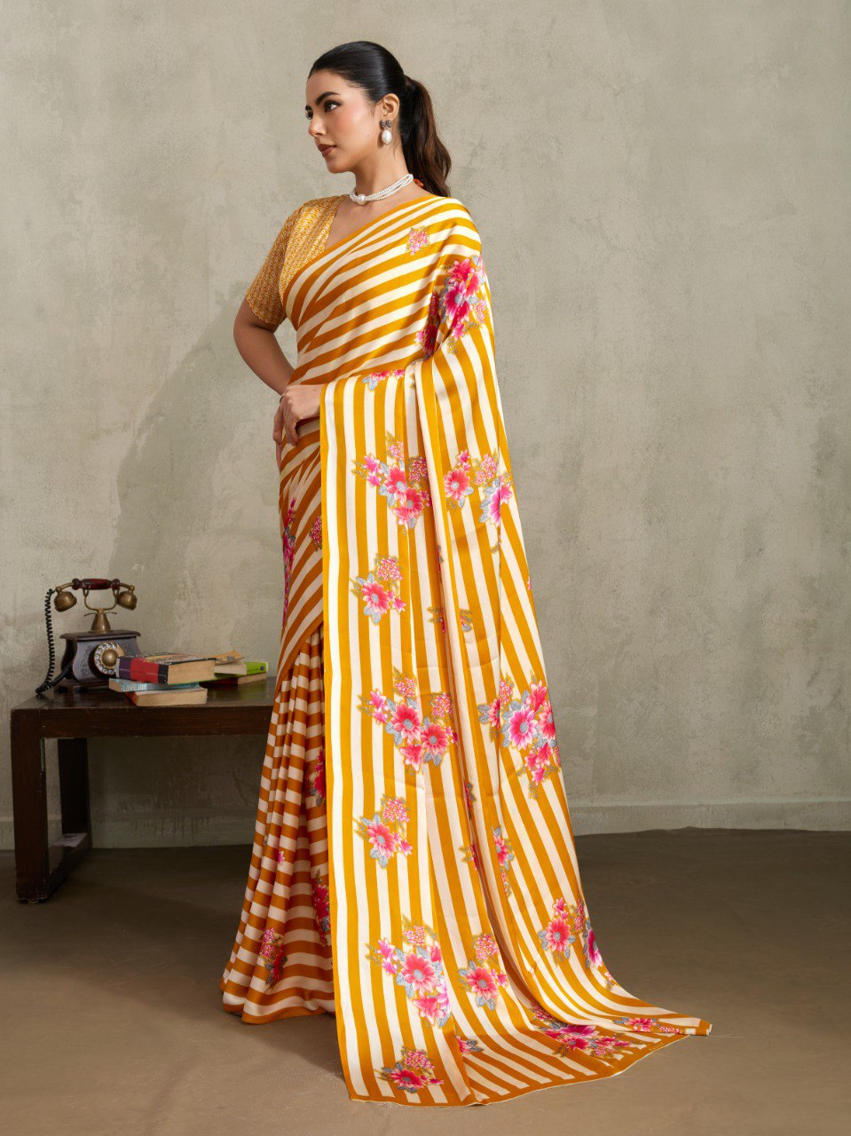 Pure Ajrakh modal satin fabric featuring traditional printed motifs with rich, earthy tones and a soft, breathable feel, perfect for all-day elegance.