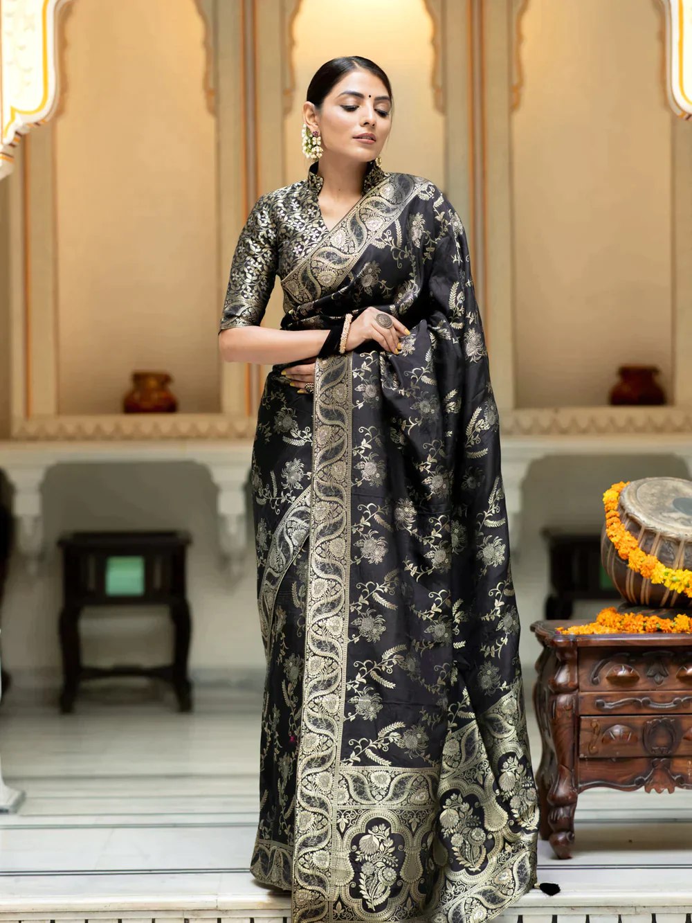 The richly crafted border and opulent pallu showcase traditional Banarasi Silk sarees