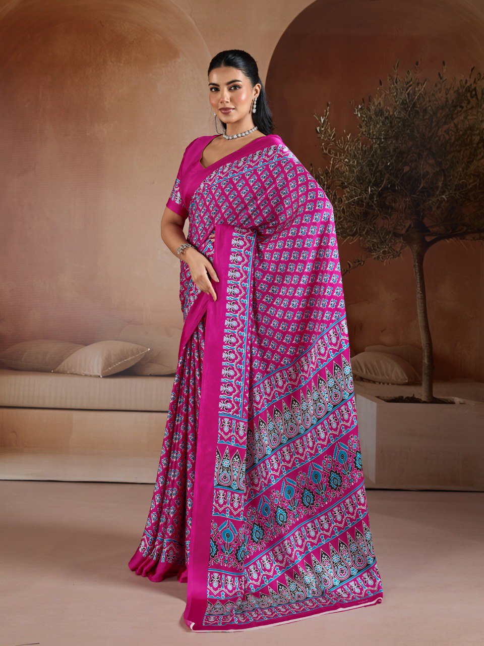 Pure Ajrakh modal satin fabric featuring traditional printed motifs with rich, earthy tones and a soft, breathable feel, perfect for all-day elegance.