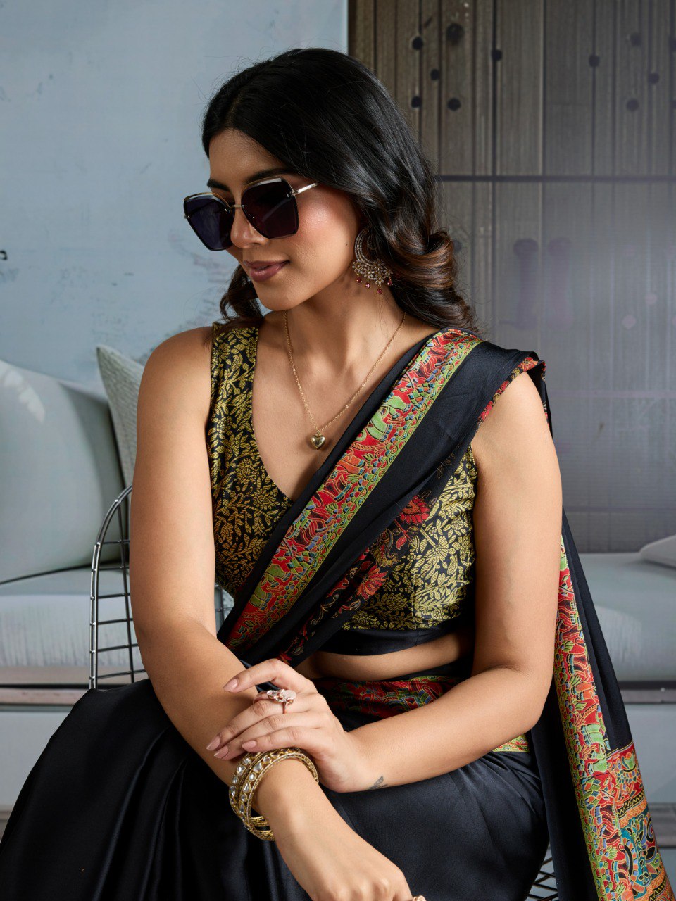 Pure Ajrakh modal satin fabric featuring traditional printed motifs with rich, earthy tones and a soft, breathable feel, perfect for all-day elegance.