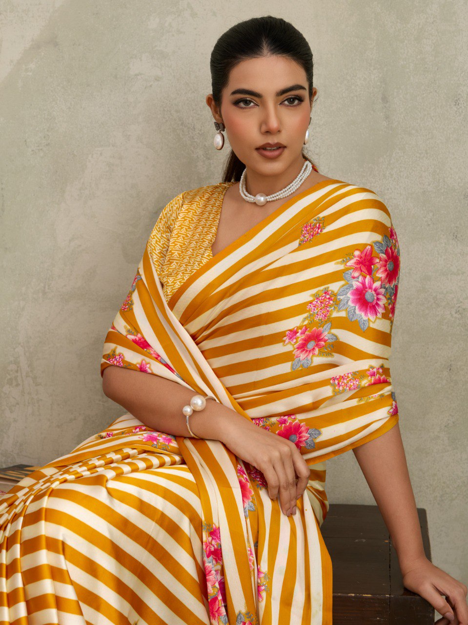 Pure Ajrakh modal satin fabric featuring traditional printed motifs with rich, earthy tones and a soft, breathable feel, perfect for all-day elegance.
