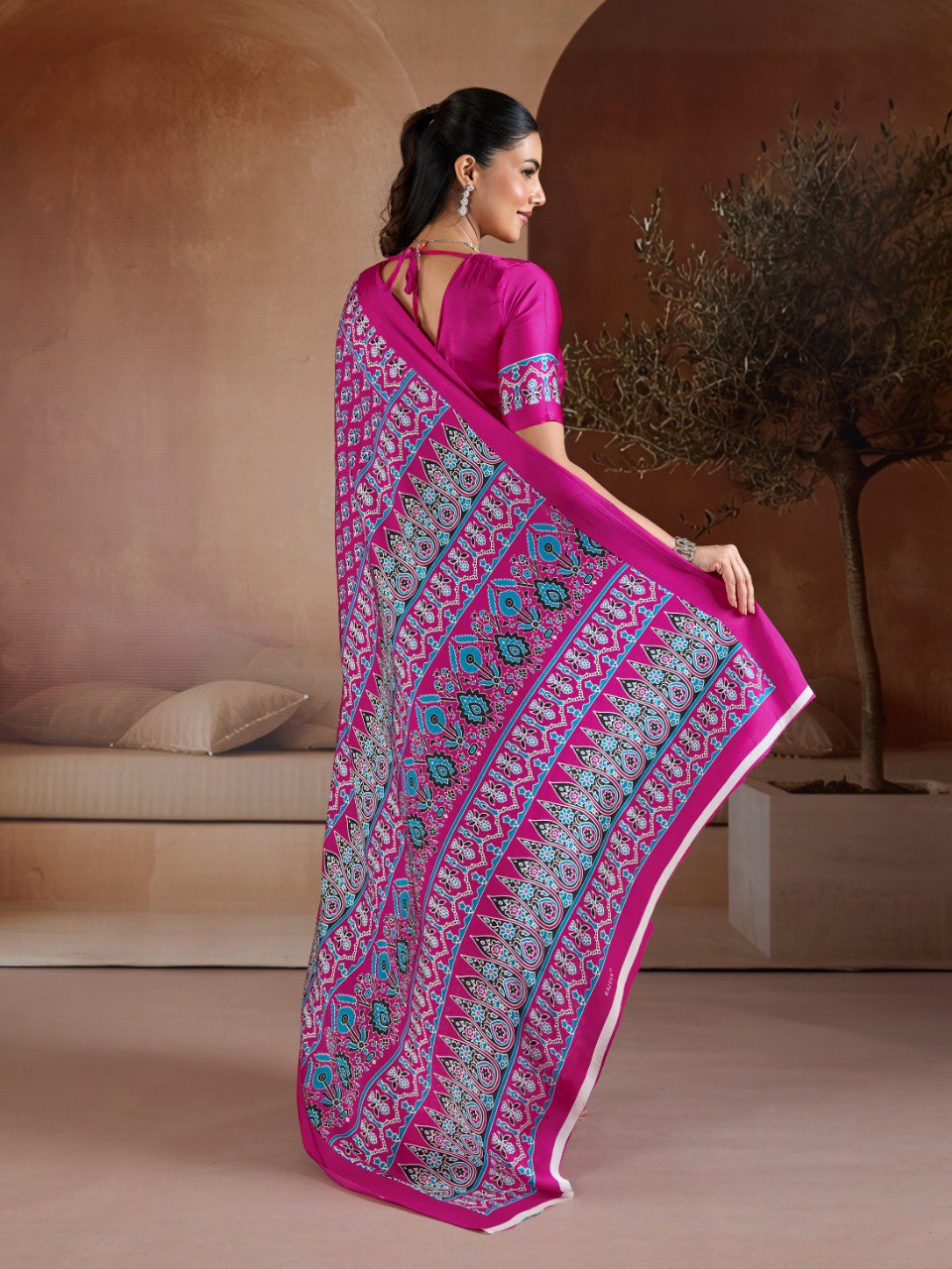 Pure Ajrakh modal satin fabric featuring traditional printed motifs with rich, earthy tones and a soft, breathable feel, perfect for all-day elegance.