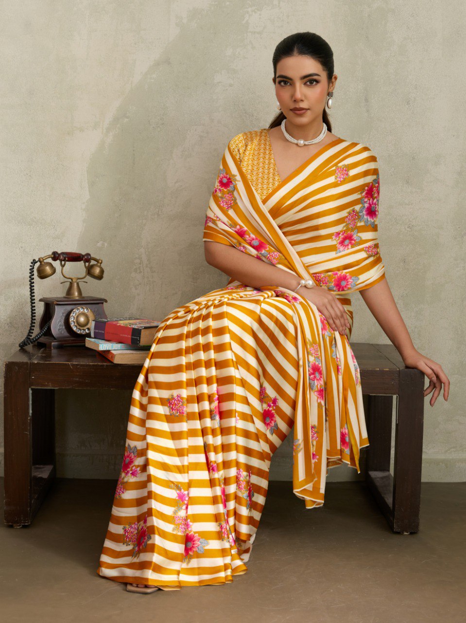 Pure Ajrakh modal satin fabric featuring traditional printed motifs with rich, earthy tones and a soft, breathable feel, perfect for all-day elegance.