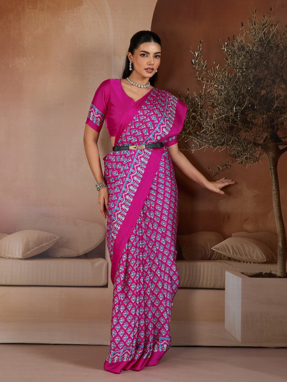 Pure Ajrakh modal satin fabric featuring traditional printed motifs with rich, earthy tones and a soft, breathable feel, perfect for all-day elegance.