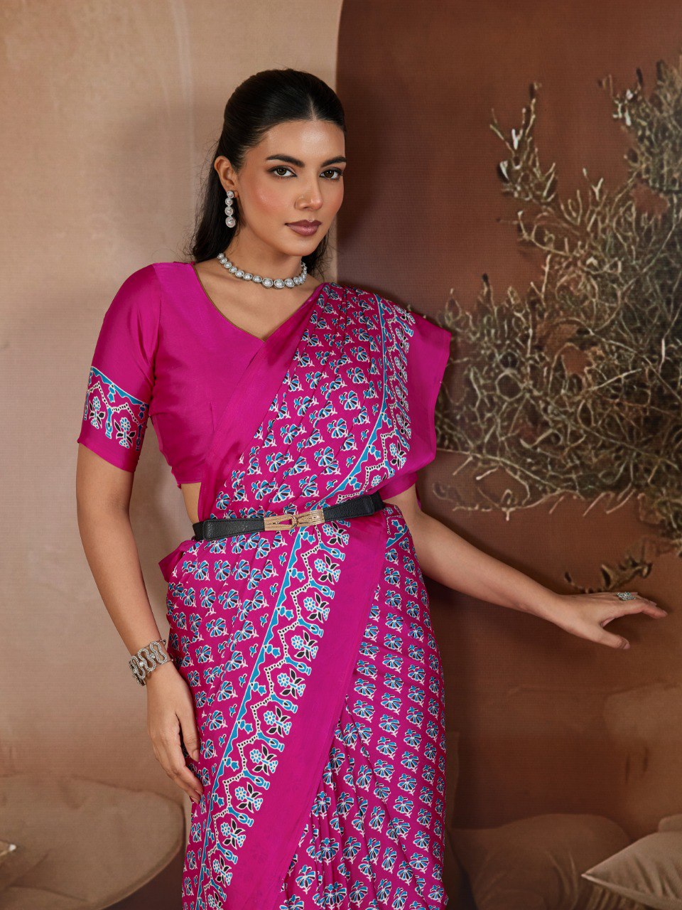 Pure Ajrakh modal satin fabric featuring traditional printed motifs with rich, earthy tones and a soft, breathable feel, perfect for all-day elegance.