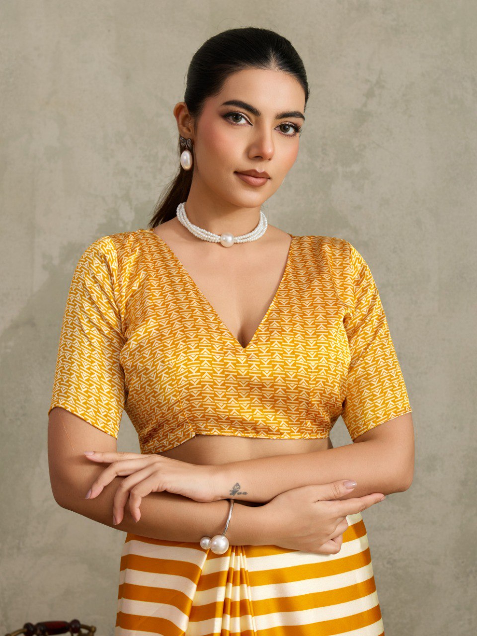 Pure Ajrakh modal satin fabric featuring traditional printed motifs with rich, earthy tones and a soft, breathable feel, perfect for all-day elegance.
