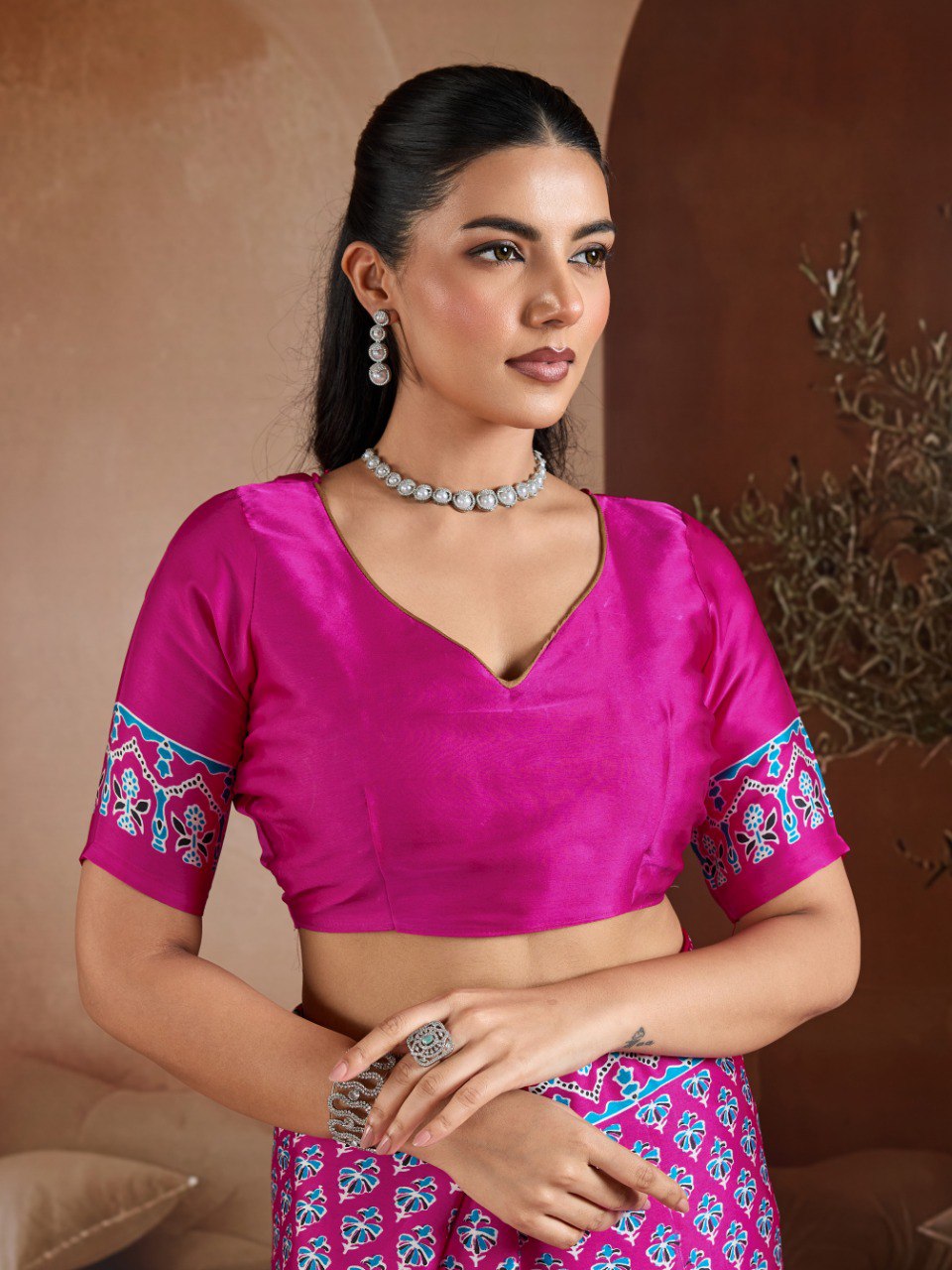 Pure Ajrakh modal satin fabric featuring traditional printed motifs with rich, earthy tones and a soft, breathable feel, perfect for all-day elegance.