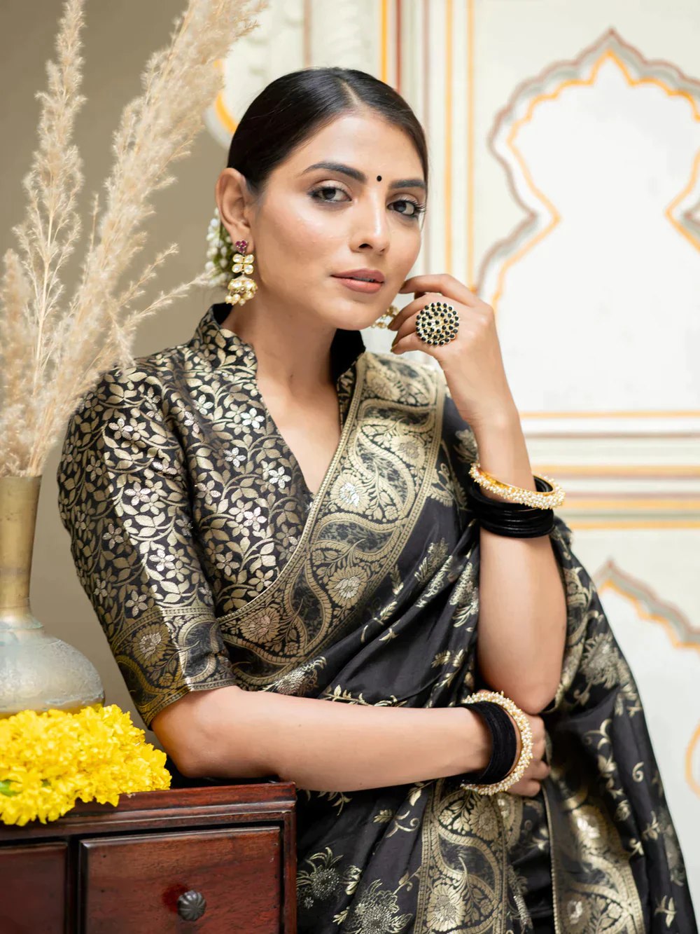 The richly crafted border and opulent pallu showcase traditional Banarasi Silk sarees