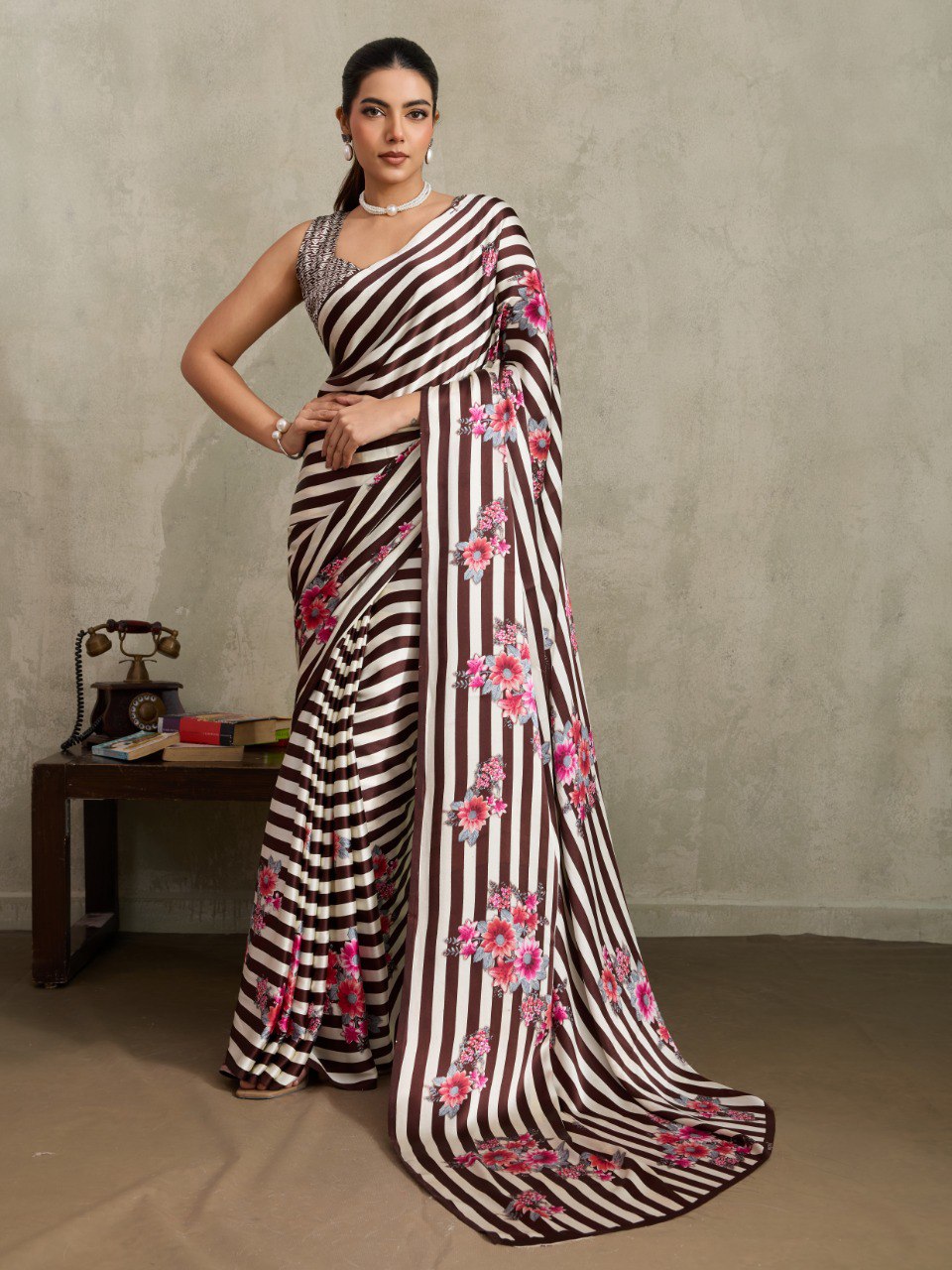Pure Ajrakh modal satin fabric featuring traditional printed motifs with rich, earthy tones and a soft, breathable feel, perfect for all-day elegance.
