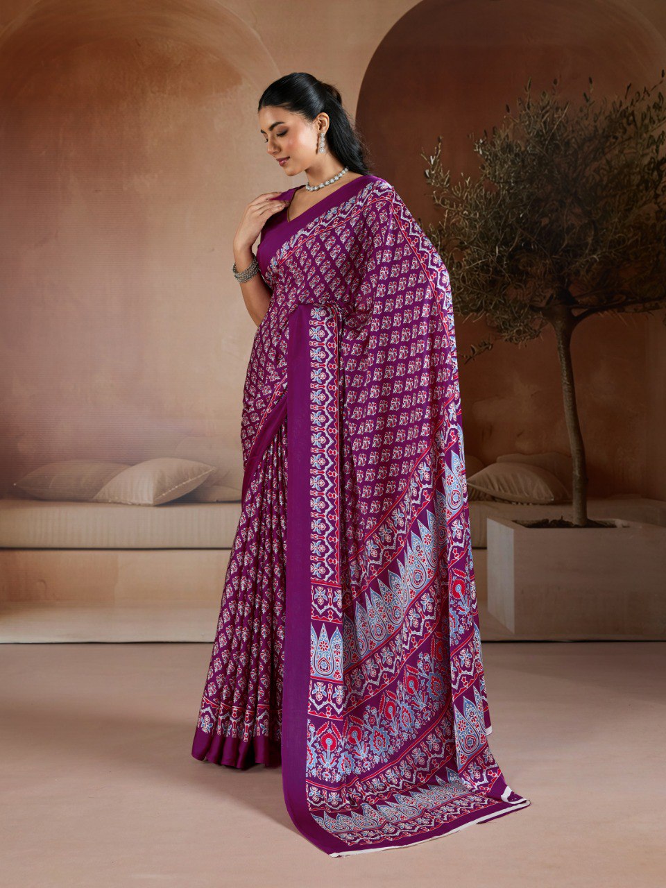 Pure Ajrakh modal satin fabric featuring traditional printed motifs with rich, earthy tones and a soft, breathable feel, perfect for all-day elegance.
