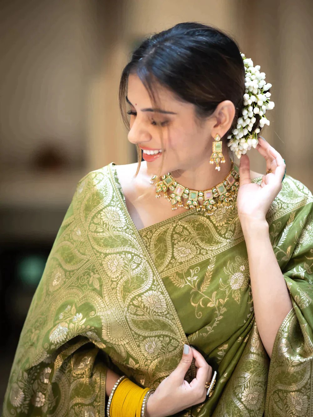 The richly crafted border and opulent pallu showcase traditional Banarasi Silk sarees