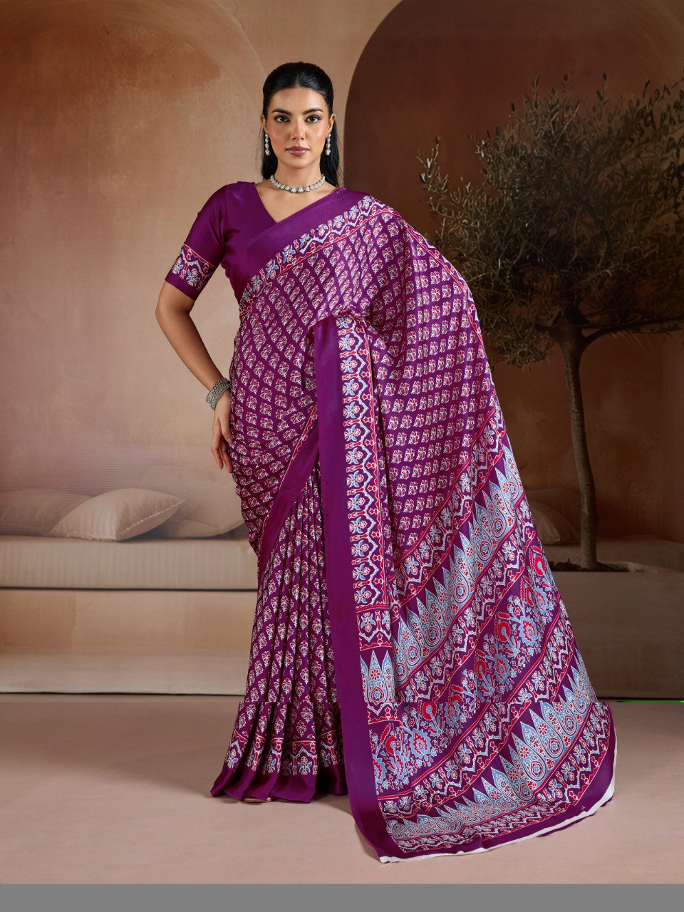 Pure Ajrakh modal satin fabric featuring traditional printed motifs with rich, earthy tones and a soft, breathable feel, perfect for all-day elegance.
