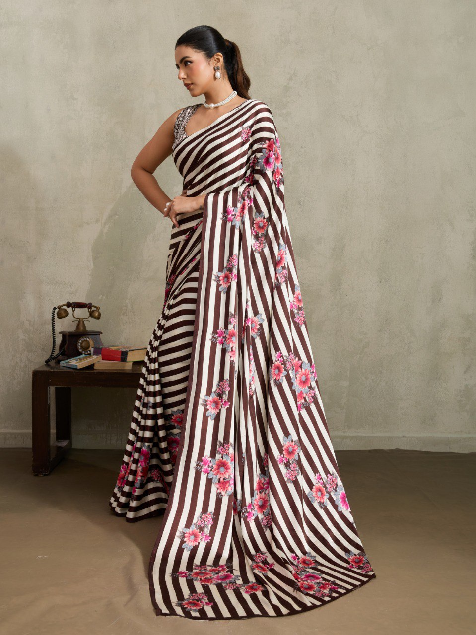 Pure Ajrakh modal satin fabric featuring traditional printed motifs with rich, earthy tones and a soft, breathable feel, perfect for all-day elegance.