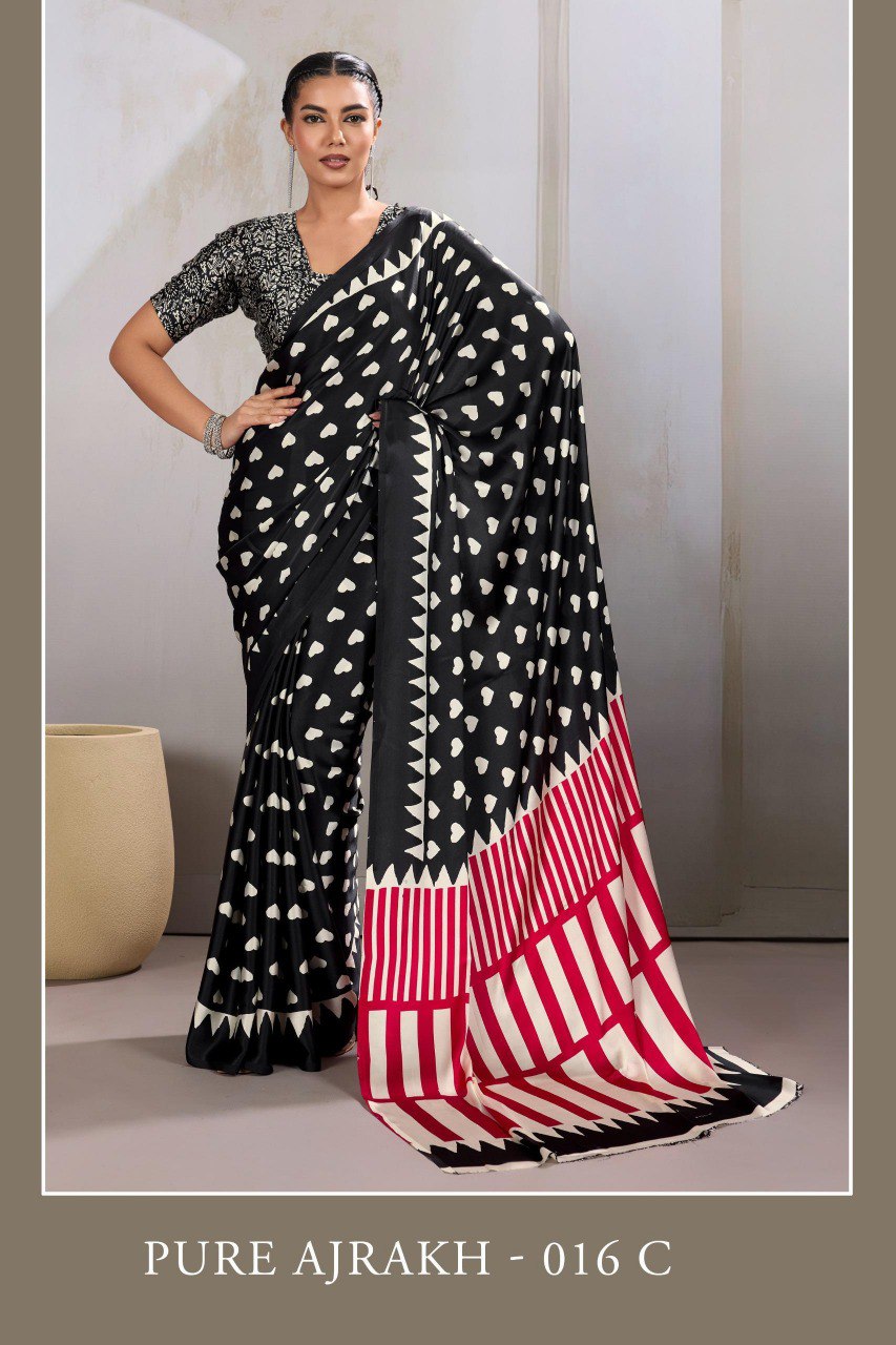 Pure Ajrakh modal satin fabric featuring traditional printed motifs with rich, earthy tones and a soft, breathable feel, perfect for all-day elegance.