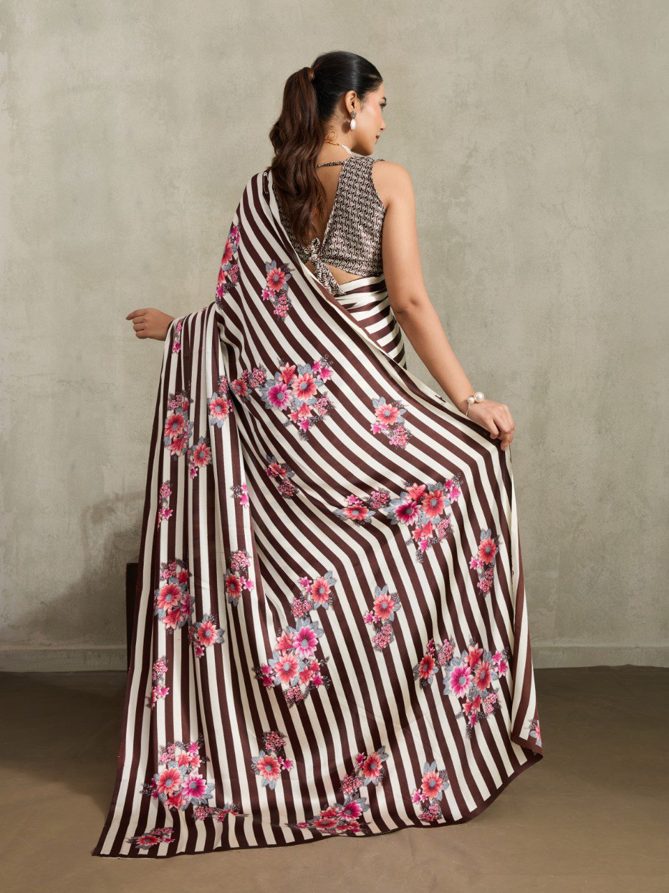 Pure Ajrakh modal satin fabric featuring traditional printed motifs with rich, earthy tones and a soft, breathable feel, perfect for all-day elegance.