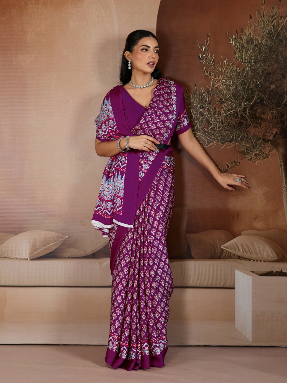 Pure Ajrakh modal satin fabric featuring traditional printed motifs with rich, earthy tones and a soft, breathable feel, perfect for all-day elegance.