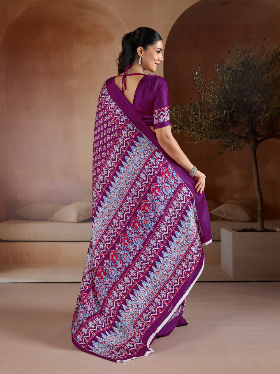 Pure Ajrakh modal satin fabric featuring traditional printed motifs with rich, earthy tones and a soft, breathable feel, perfect for all-day elegance.