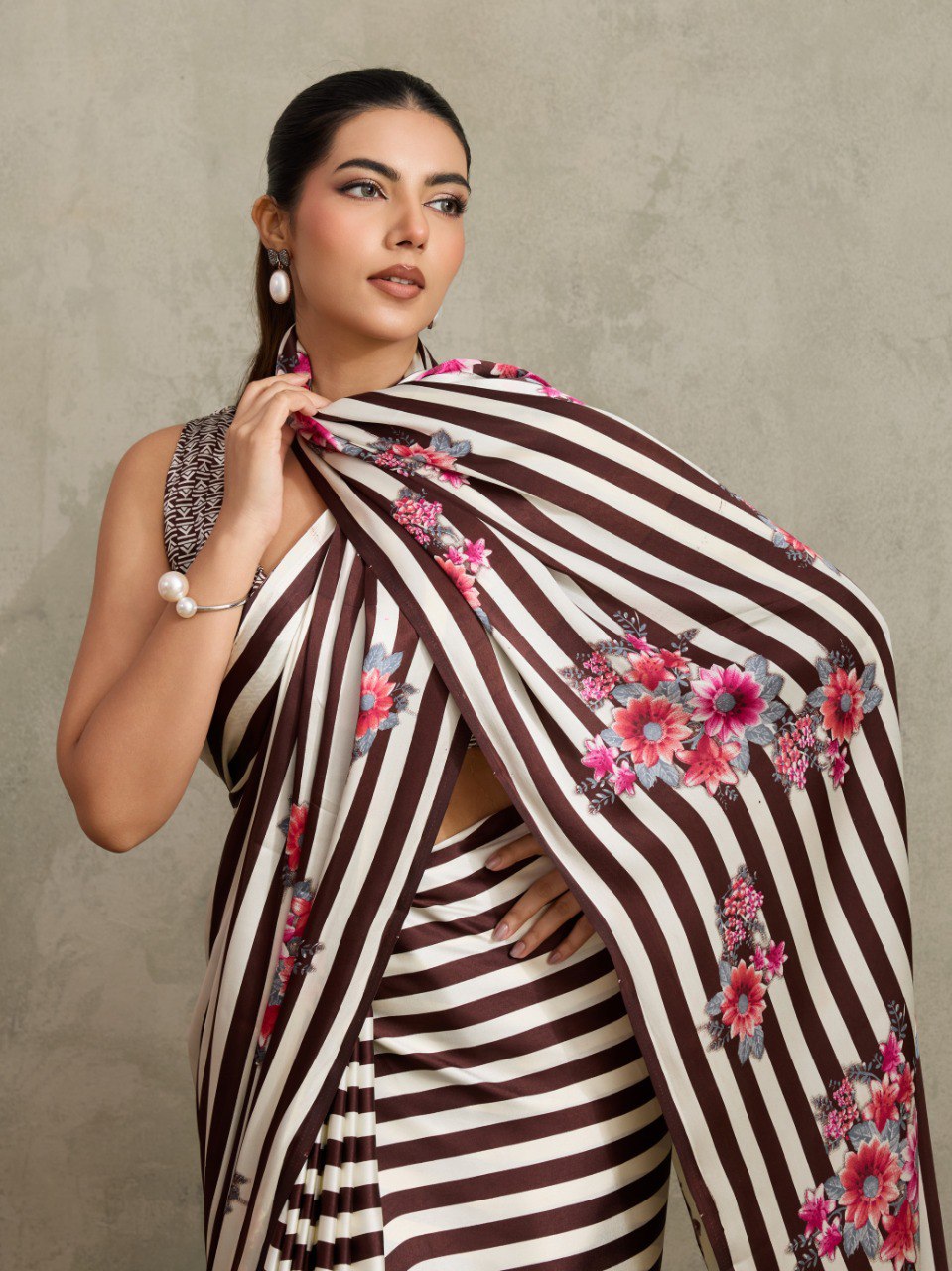 Pure Ajrakh modal satin fabric featuring traditional printed motifs with rich, earthy tones and a soft, breathable feel, perfect for all-day elegance.