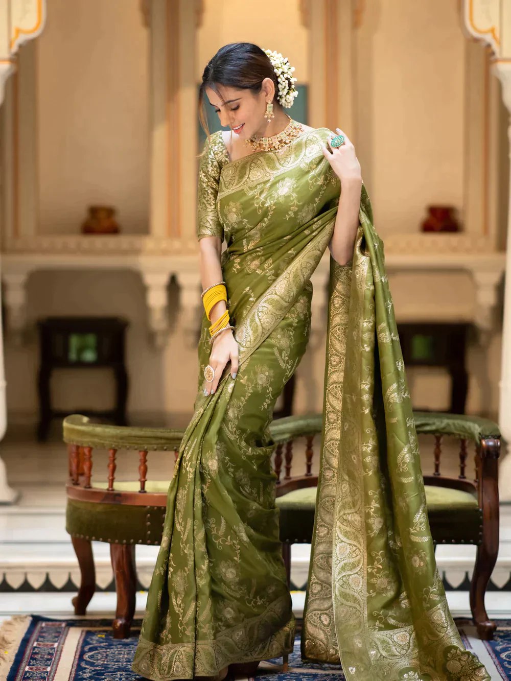 The richly crafted border and opulent pallu showcase traditional Banarasi Silk sarees